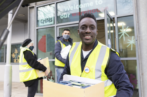 Ayo Akinwolere volunteers at Crisis at Christmas 2021