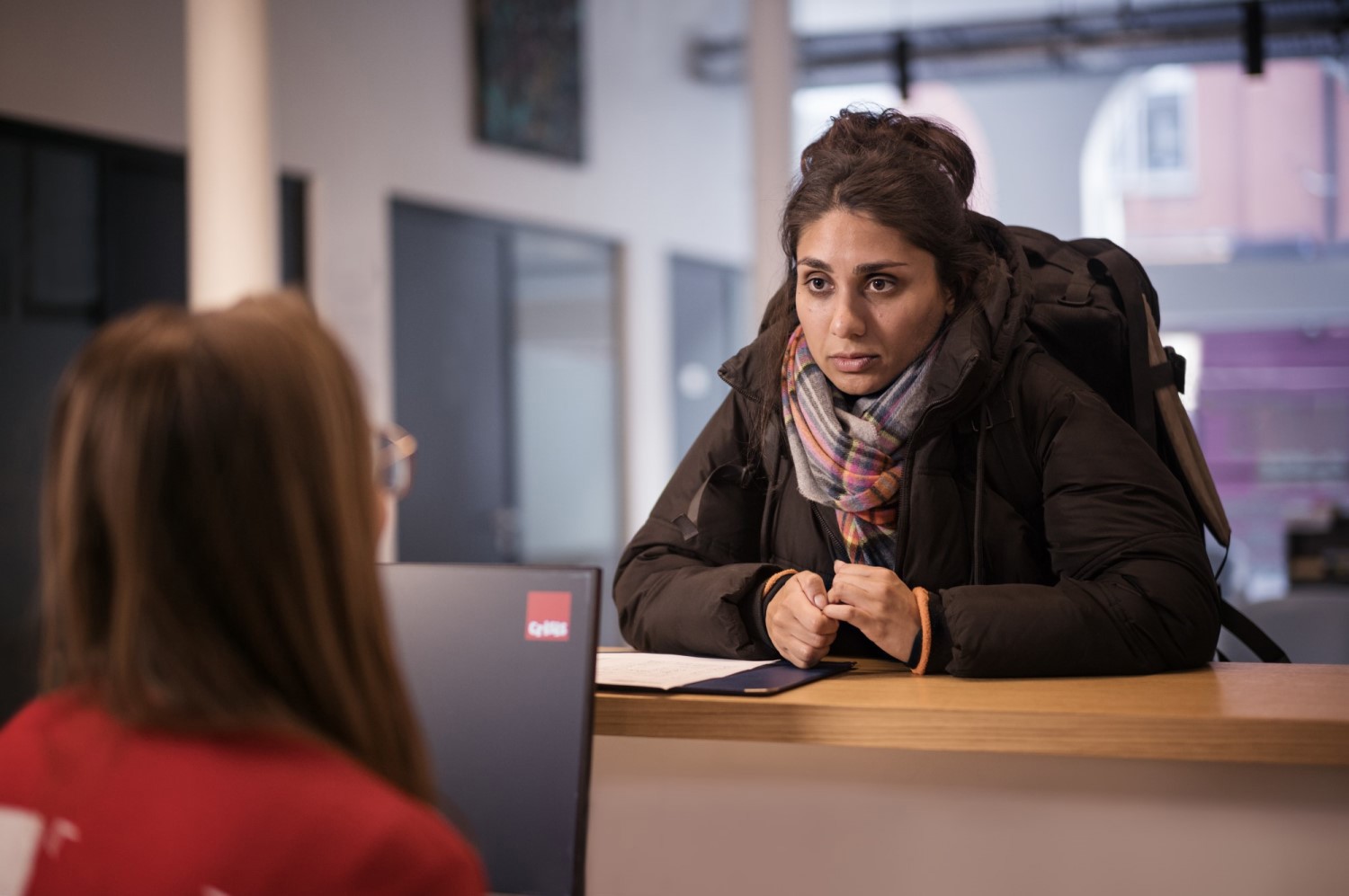A woman at Crisis reception asking for help